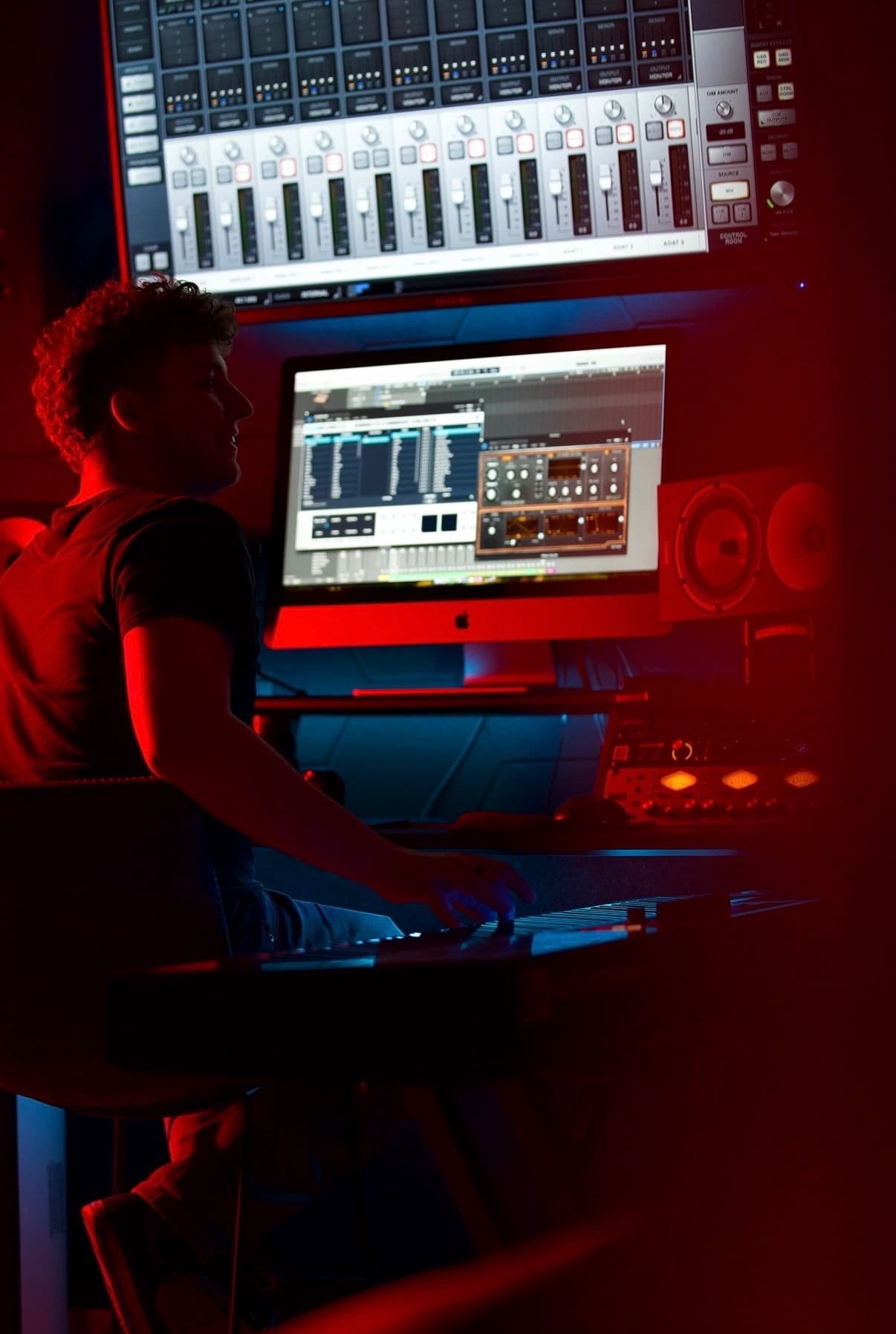 Chase Wessling working at a studio console